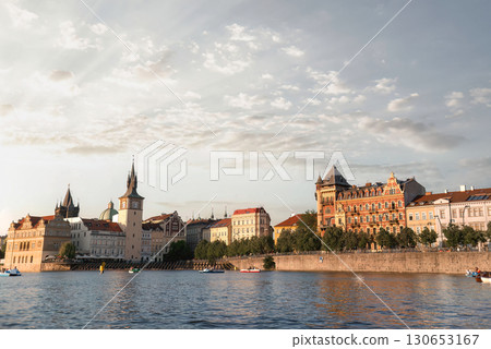 Sunny day on the Vltava river: tourists taking in the stunning Prague skyline. Czech Republic Sunny day on the Vltava river: tourists taking in the stunning Prague skyline. Czech Republic 130653167
