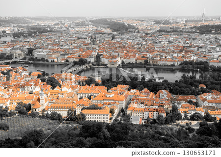 Beautiful aerial view of Prague's cityscape, showcasing the iconic roofs and historic bridges spanning the Vltava river Beautiful aerial view of Prague's cityscape, showcasing the iconic roofs and historic bridges spanning the Vltava river 130653171