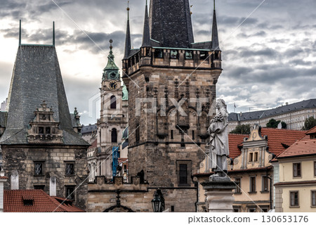 Statue of St. Philip Benitius at Prague Bridge Tower with dramatic sky in the background, Czech Republic 130653176