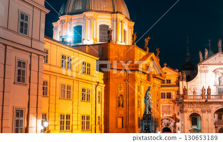 Illuminated night view of the stunning Klementinum and Church of St. Salvator in Prague, Czech Republic 130653189