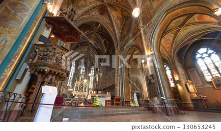 The interior of Basilica of Sts Peter and Paul with frescoes on the walls and ceiling and an ornate wooden pulpit. Prague, Czech Republic The interior of Basilica of Sts Peter and Paul with frescoes on the walls and ceiling and an ornate wooden pulpit. Prague, Czech Republic 130653245