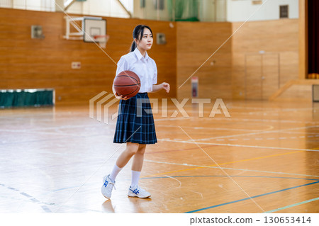 High school students playing basketball 130653414
