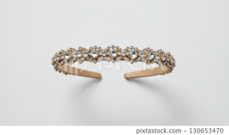 Jeweled headband isolated on white background, crystal accessory, close-up, sparkling details 130653470
