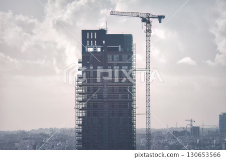 Modern skyscraper is being built in an urban city center of Limassol, Cyprus Modern skyscraper is being built in an urban city center of Limassol, Cyprus 130653566