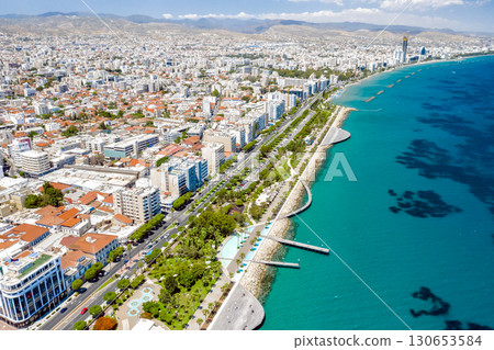 Limassol cityscape with palm trees lining the coastline on a sunny day. Cyprus Limassol cityscape with palm trees lining the coastline on a sunny day. Cyprus 130653584