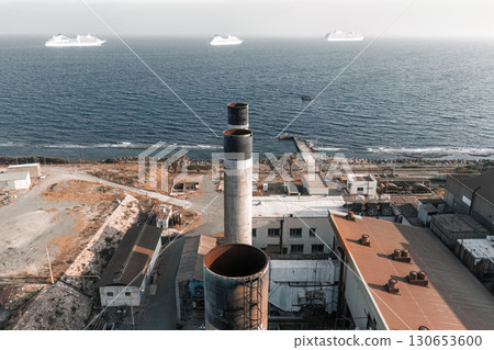 Chimneys of Moni Power Station with cruise ships on the horizon. Limassol, Cyprus 130653600