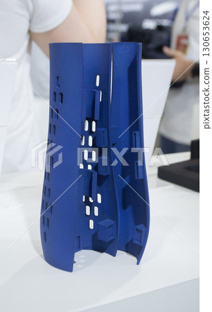 Object printed on 3D printer from molten plastic powder close-up. Model of blue color printed on 3D printer from melted polyamide powder. Modern additive 3D printing technology. Multi Jet Fusion MJF 130653624