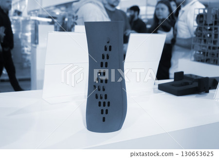 Object printed on 3D printer from molten plastic powder close-up. Model of blue color printed on 3D printer from melted polyamide powder. Modern additive 3D printing technology. Multi Jet Fusion MJF 130653625
