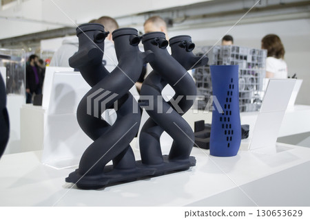Object printed on 3D printer from molten plastic powder close-up. Model of black color printed on 3D printer from melted polyamide powder. Modern additive 3D printing technology. Multi Jet Fusion MJF 130653629