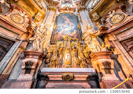 Ornate altar with gold and marble detailing in St. Nicholas Church. Mala Strana, Prague, Czech Republic 130653640