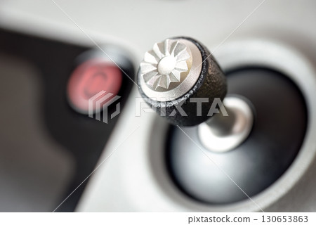 Modern drone controller with throttle lever and buttons for controlling 130653863