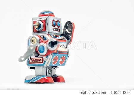 Classic toy robot standing and waving on white background Classic toy robot standing and waving on white background 130653864