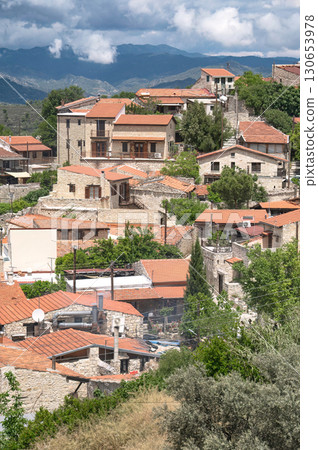 Traditional stone houses with red tile roofs in Lofou village. 130653978