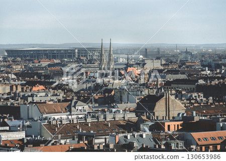 Budapest cityscape with church steeple rising above rooftops Budapest cityscape with church steeple rising above rooftops 130653986