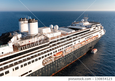 Large cruise ship sailing on the ocean on a sunny day 130654123