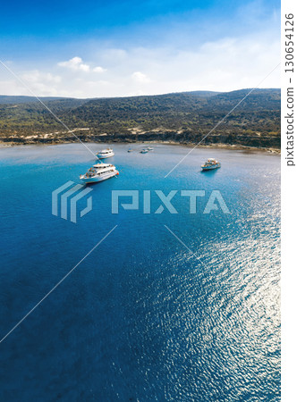 Tourist cruise boats are floating in Blue Lagoon near Latchi. Polis, Cyprus 130654126