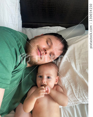 Father and Baby Enjoying a Happy Moment Father and Baby Enjoying a Happy Moment 130654150