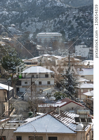 Kakopetria village in Troodos mountains covered in snow during winter. Nicosia District, Cyprus Kakopetria village in Troodos mountains covered in snow during winter. Nicosia District, Cyprus 130654839
