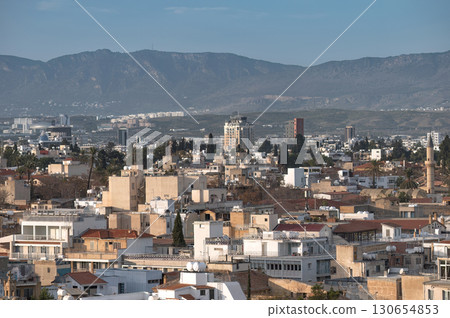 Cityscape of Nicosia, Cyprus, showing dense buildings and the Pentadactylos mountains Cityscape of Nicosia, Cyprus, showing dense buildings and the Pentadactylos mountains 130654853
