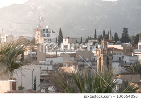 Nicosia Old Town cityscape with church tower and Pentadactylos mountains in background, Cyprus Nicosia Old Town cityscape with church tower and Pentadactylos mountains in background, Cyprus 130654856