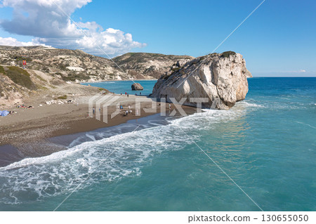 Tourists enjoying beach and Aphrodite's rock (Petra tou Romiou) in Cyprus 130655050