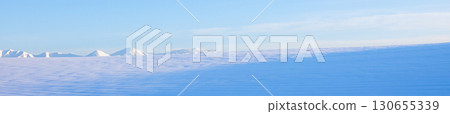 A snowy winter landscape in Biei, Hokkaido, with a view of the blue sky and the Tokachi mountain range 130655339