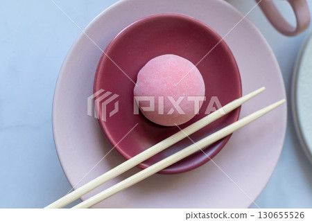Pink mochi dessert with cream filling and berry. Pink mochi dessert with cream filling and berry. 130655526