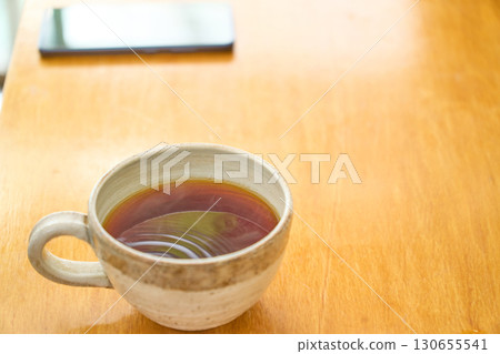 Pouring coffee into a mug. A series of photos showing the process of brewing drip coffee. Pouring coffee into a mug. A series of photos showing the process of brewing drip coffee. 130655541