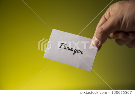I love you text on a paper with a card 130655567