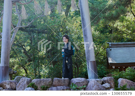 A woman in a kimono posing in front of a torii gate | Japanese garden, Japanese style, tourism image A woman in a kimono posing in front of a torii gate | Japanese garden, Japanese style, tourism image 130655579