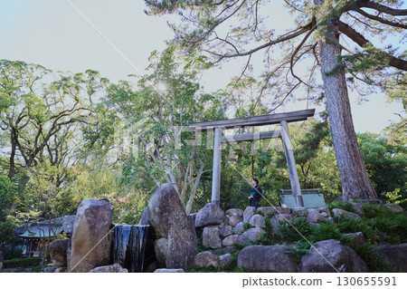 A woman in a kimono posing in front of a torii gate | Japanese garden, Japanese style, tourism image 130655591