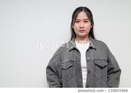 Portrait of young stylish Asian woman against white background Portrait of young stylish Asian woman against white background 130655966