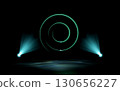 A glowing green neon spiral hovers over a dark stage, illuminated by two teal spotlights casting volumetric light beams and reflections on the floor. Abstract, futuristic digital concept. 130656227