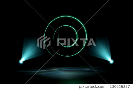 A glowing green neon spiral hovers over a dark stage, illuminated by two teal spotlights casting volumetric light beams and reflections on the floor. Abstract, futuristic digital concept. A glowing green neon spiral hovers over a dark stage, illuminated by two teal spotlights casting volumetric light beams and reflections on the floor. Abstract, futuristic digital concept. 130656227