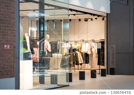 Radio-frequency security gates with integrated metal detector at a clothing store entrance 130656458