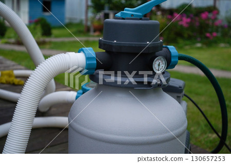 The circulation pump for the filtration and ozone treatment system to keep an outdoor pool clean. 130657253