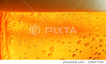 Macro Shot of Pouring Beer Drink , abstract bacground Macro Shot of Pouring Beer Drink , abstract bacground 130657594