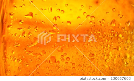 Macro Shot of Pouring Beer Drink , abstract bacground Macro Shot of Pouring Beer Drink , abstract bacground 130657603