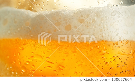 Macro Shot of Pouring Beer Drink , abstract bacground 130657604