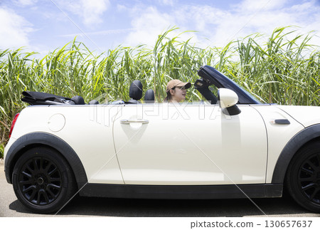 A young woman sightseeing in Okinawa by car 130657637