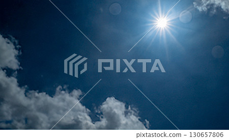 Blue sky, sun and white clouds Blue sky, sun and white clouds 130657806