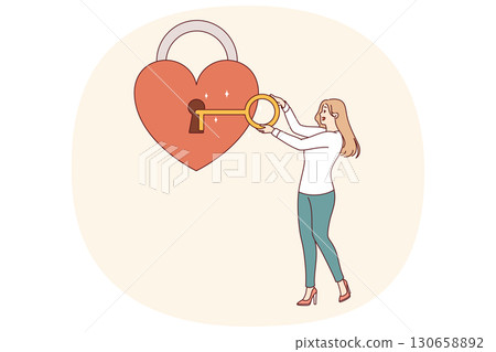 Woman opens padlock-shaped heart with key, symbolizing kindness and empathy or love Woman opens padlock-shaped heart with key, symbolizing kindness and empathy or love 130658892