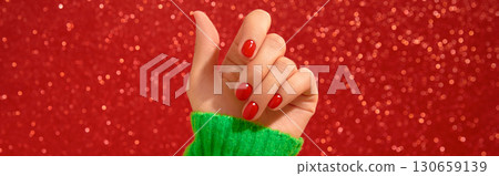 Womans hand with red minimalist nail design. Manicure, pedicure beauty salon concept Womans hand with red minimalist nail design. Manicure, pedicure beauty salon concept 130659139