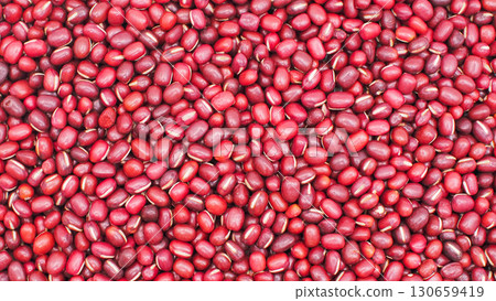 Full frame close-up of red adzuki beans, showing natural texture and color, ideal for food, agriculture, and nutrition concepts. Full frame close-up of red adzuki beans, showing natural texture and color, ideal for food, agriculture, and nutrition concepts. 130659419