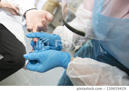 Take a blood test from a finger in a medical laboratory close-up. 130659429