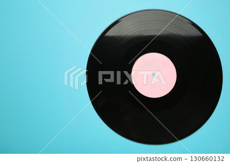 Vinyl record on blue background. Space for text Vinyl record on blue background. Space for text 130660132