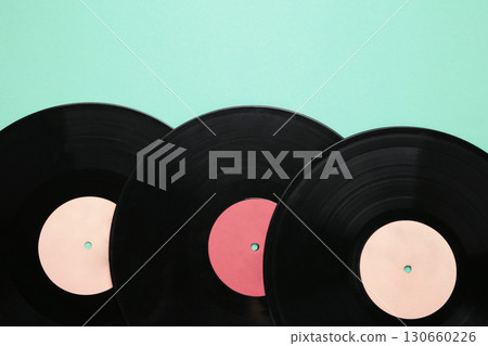 Gramophone vinyl records on mint background. 130660226