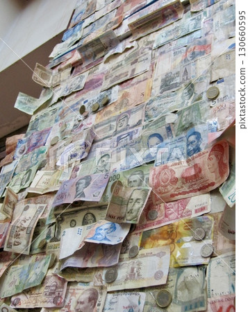 Wall art featuring countless foreign banknotes and coins. Ideal for spatial presentations, magazines, art designs, etc. Wall art featuring countless foreign banknotes and coins. Ideal for spatial presentations, magazines, art designs, etc. 130660595