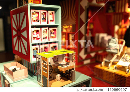 Colorful Display of Bespoke Dollhouses and Accessories Showcasing the Charm of Miniature Living Spaces in a Vibrant Retail Environment Colorful Display of Bespoke Dollhouses and Accessories Showcasing the Charm of Miniature Living Spaces in a Vibrant Retail Environment 130660697