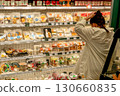 A Shopper's Dilemma: Choosing from a Colorful Array of Prepared Meals and Snacks in a Grocery Store Aisle 130660835